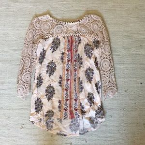 Peach top with floral designs